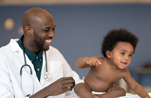 Child in doctor's hands